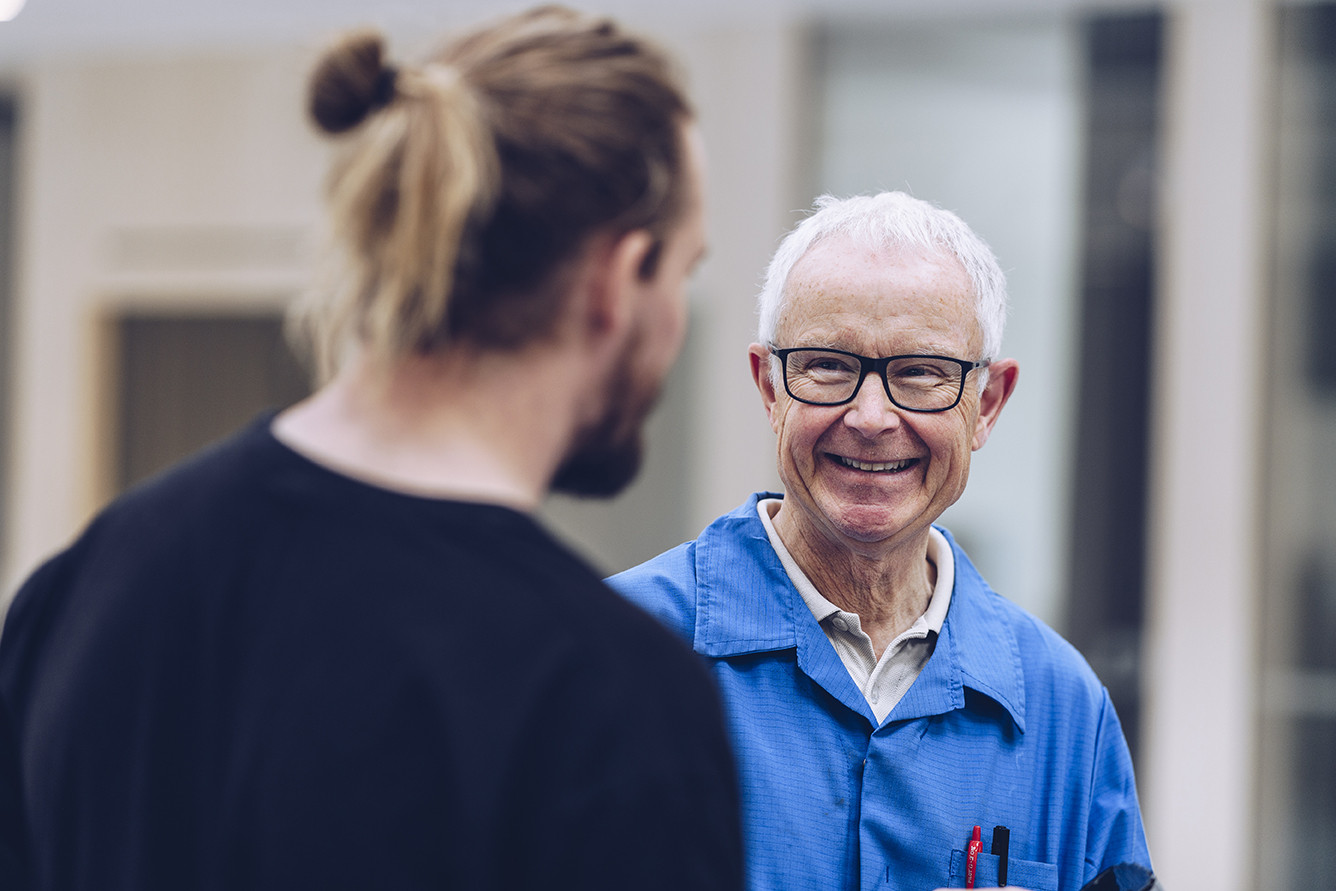 Engineers at Micropower Group, smiling at each other.