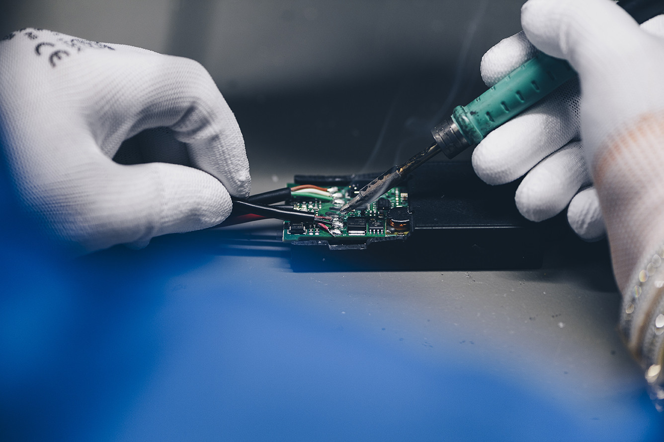 An engineer working at a custom battery solution for a customer.