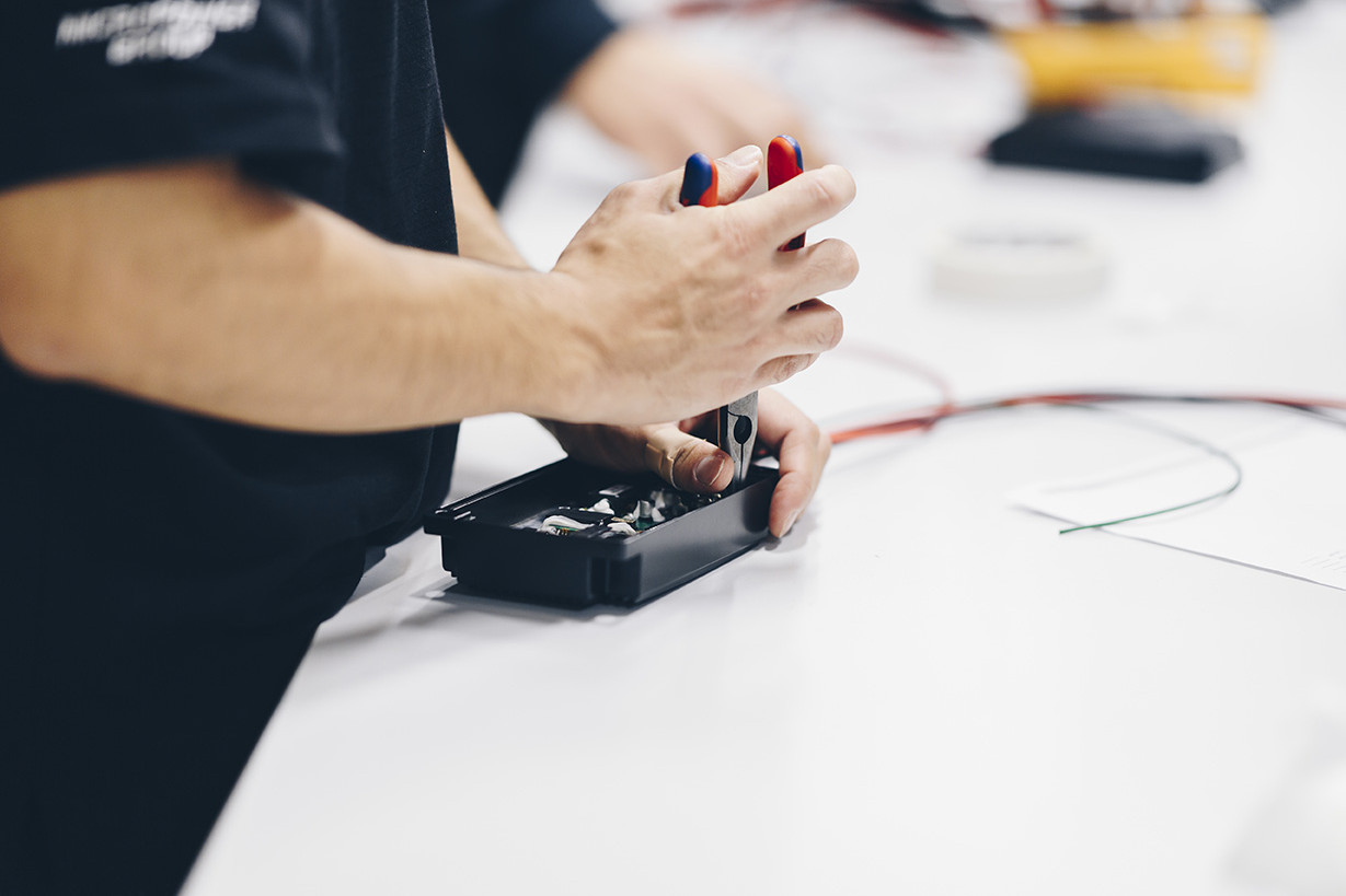 An engineer working by hand with a dcdc converter from Micropower Group